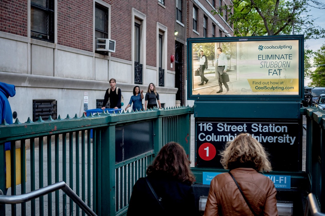 CoolSculpting ad above the 116 Street Columbia University subway station entrance