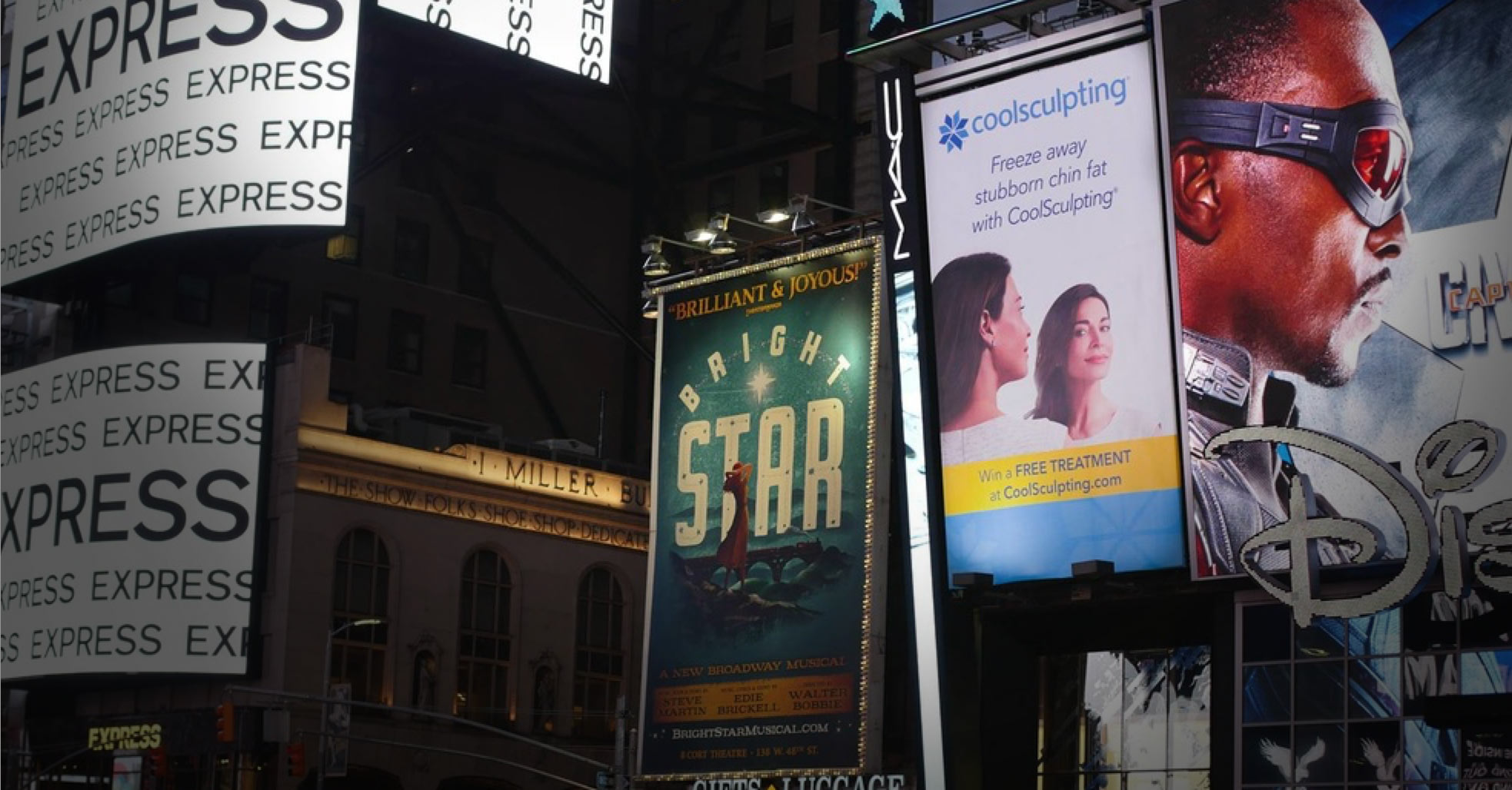 Vertical CoolSculpting billboard in Times Square alongside Broadway and retail signage