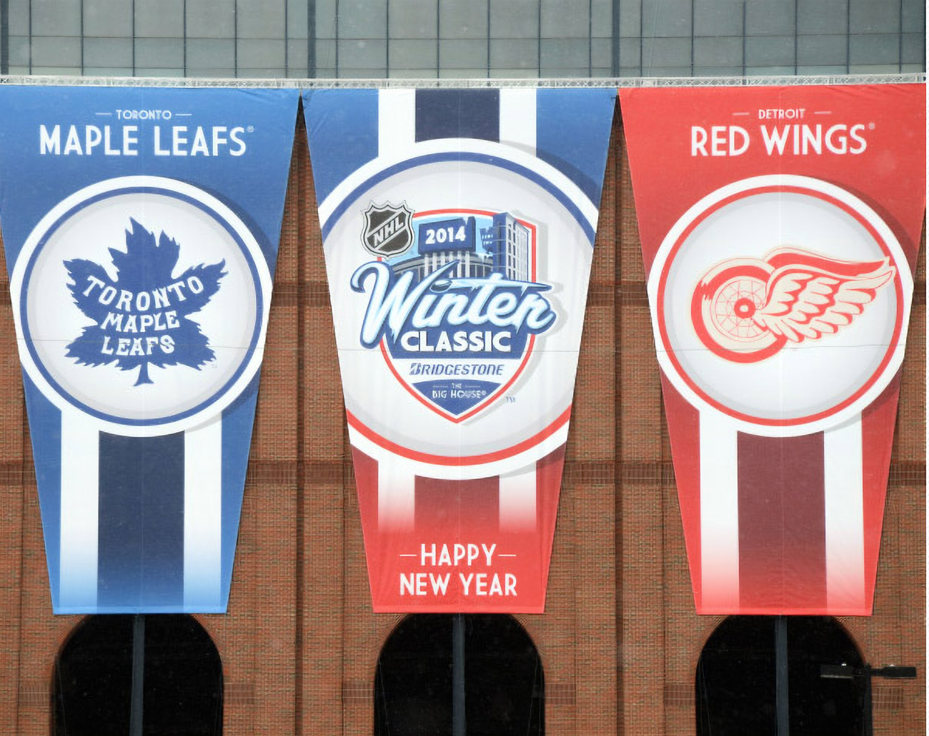 Toronto Maple Leafs, 2014 Winter Classic, and Detroit Red Wings vertical banners hung on the stadium facade